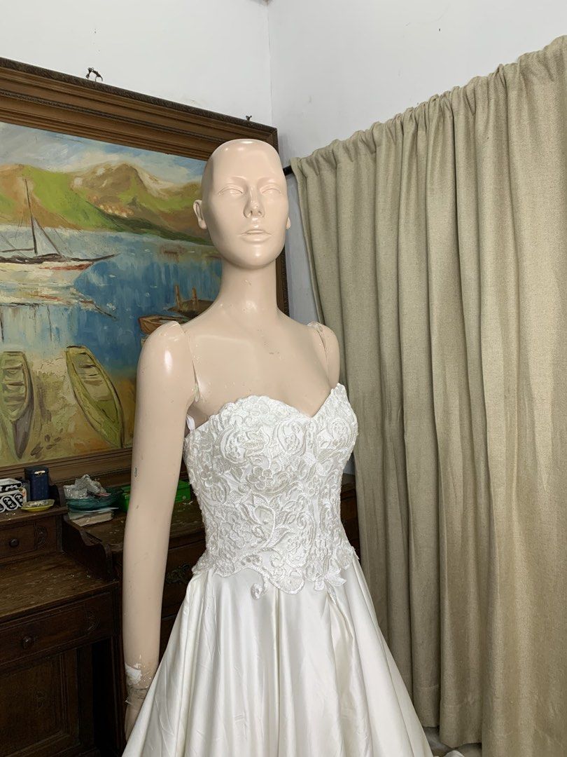 Exquisite Cathedral Train Wedding Gown (Category: Evening dresses & gowns) located in General Mariano Alvarez. Submitted by fashionlibraryph (Listing ID 1462143168, Image 2). Description: Designed for the bride who desires undeniable presence, this gown pairs romantic craftsmanship with clean, regal drama. The bodice is meticulously sculpted in rich, textured floral lace with subtle, light-catching detailing, leading into an ultra-flattering swee