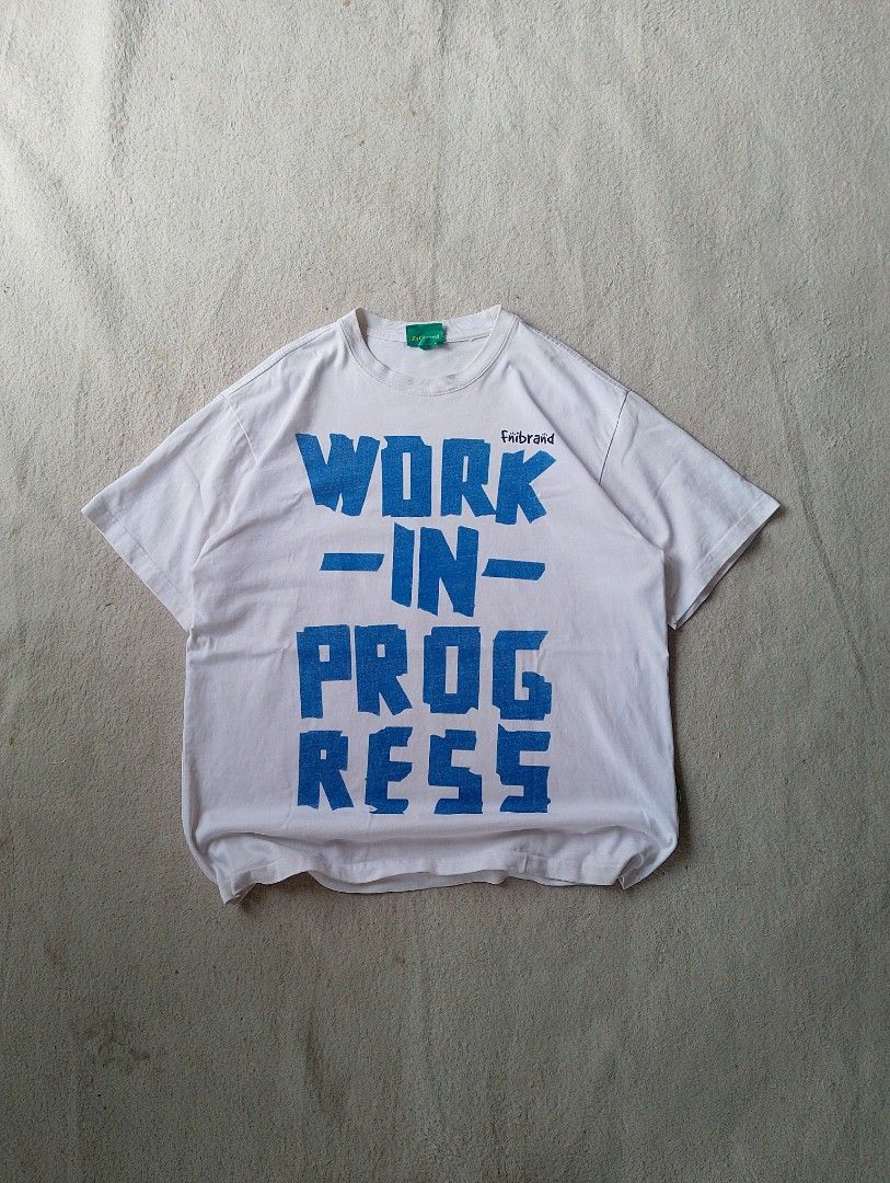 Fniibraänd "Work In Progress" Graphic Tee (Category: Tshirts & Polo Shirts ) located in Caloocan City. Submitted by sharpthreads18 (Listing ID 1462074474, Image 1). Description: - White Fniibraänd t-shirt - Bold blue "WORK-IN-PROG-RESS" graphic print - Short sleeves - Classic crew neck - Simple and direct statement piece - Great for casual wear.