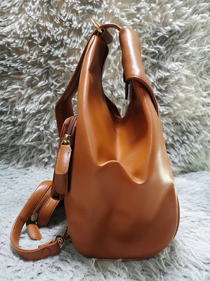 Folded Front Flap Soft Leather Backpack Bag (Category: Backpacks) located in Santa Cruz. Submitted by jmy_surplus.2 (Listing ID 1462046530, Image 2). Description: Size ; L - 12 W - 10 Color ; Tan Type ; Backpack bag Brand ; No brand Material ; Leather Style ; Tan leather Backpack bag LR 165 JMY 4 Batch #220.