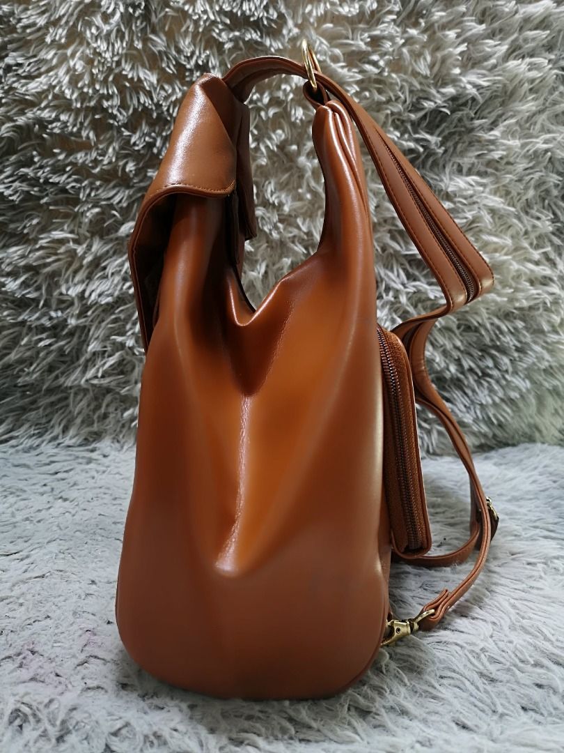 Folded Front Flap Soft Leather Backpack Bag (Category: Backpacks) located in Santa Cruz. Submitted by jmy_surplus.2 (Listing ID 1462046530, Image 3). Description: Size ; L - 12 W - 10 Color ; Tan Type ; Backpack bag Brand ; No brand Material ; Leather Style ; Tan leather Backpack bag LR 165 JMY 4 Batch #220.