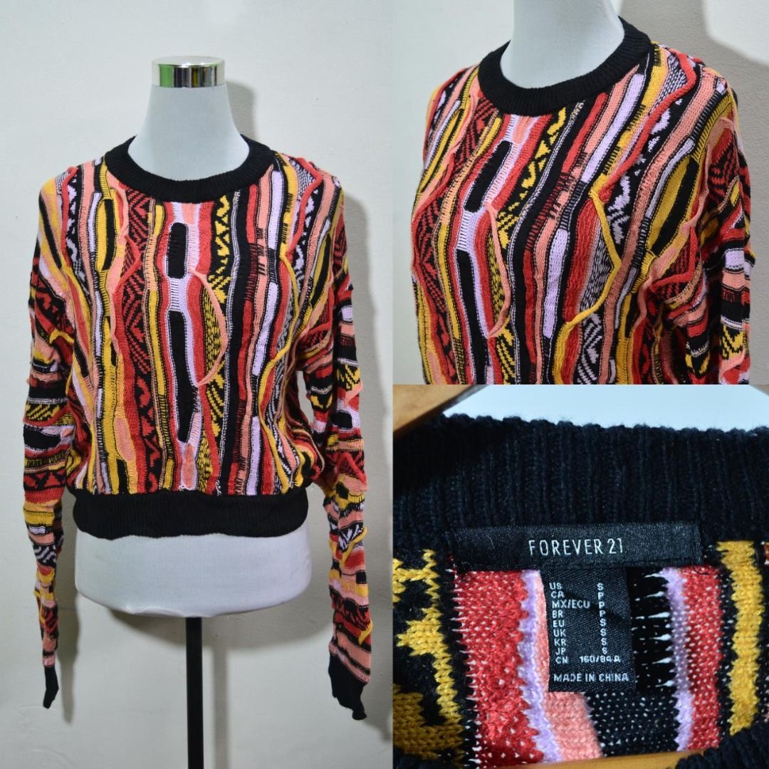 Forever 21 Colorful Knit Sweater Preloved (Category: Coats, Jackets and Outerwear) located in Polomolok. Submitted by lastthrift (Listing ID 1462201133, Image 1). Description: - Forever 21 knit sweater - Bold, colorful geometric pattern - Long sleeves and crew neck - Black trim on neckline, cuffs, and hem - Versatile: pairs well with jeans or skirts - A fun statement piece for your wardrobe - 19"x18".