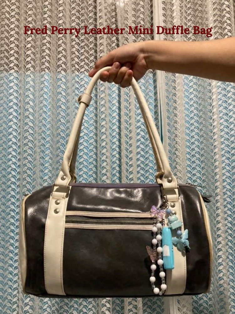 Fred Perry Mini Duffle Bag (Category: Shoulder Bags) located in Legazpi City. Submitted by boldstone_e60fc6 (Listing ID 1462121801, Image 1). Description: bilhin nyo na pls lang, nakatambak lang bagsak presyo na yan.