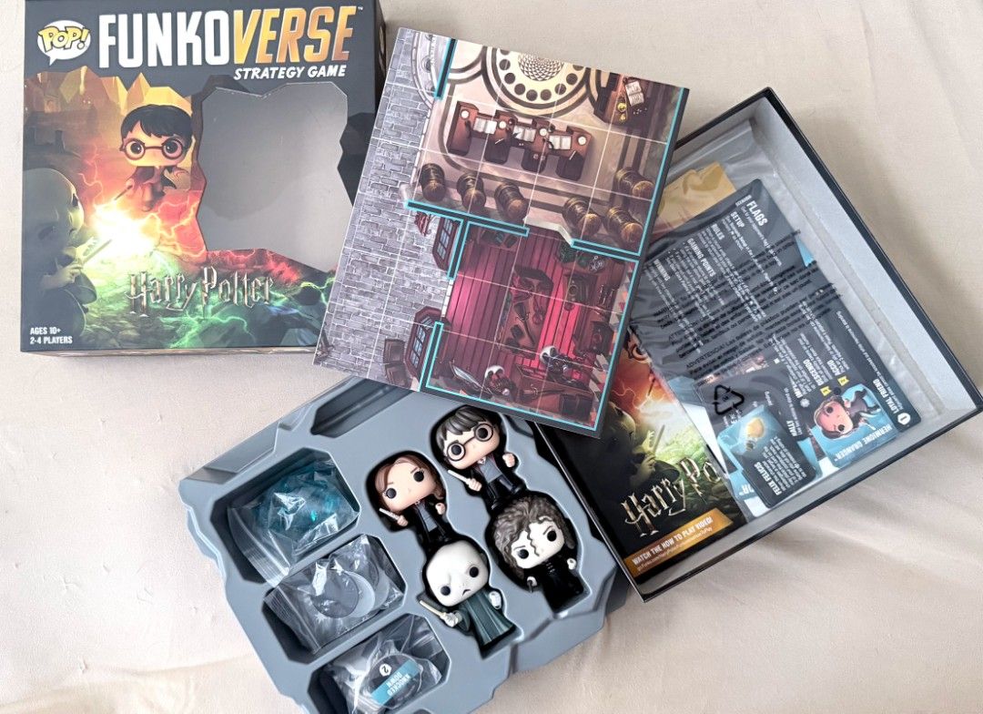 FunkoVerse Strategy Game Harry Potter (Category: Designer & Blind Box Toys) located in Manila. Submitted by shinderella15 (Listing ID 1462098124, Image 2). Description: - FunkoVerse Strategy Game: Harry Potter Edition - Includes 4 collectible Funko Pop figures: Harry Potter, Hermione Granger, Lord Voldemort, and Bellatrix Lestrange - Comes with game board tiles for strategic play - Features character cards for enhanced gameplay - Ideal for fans o