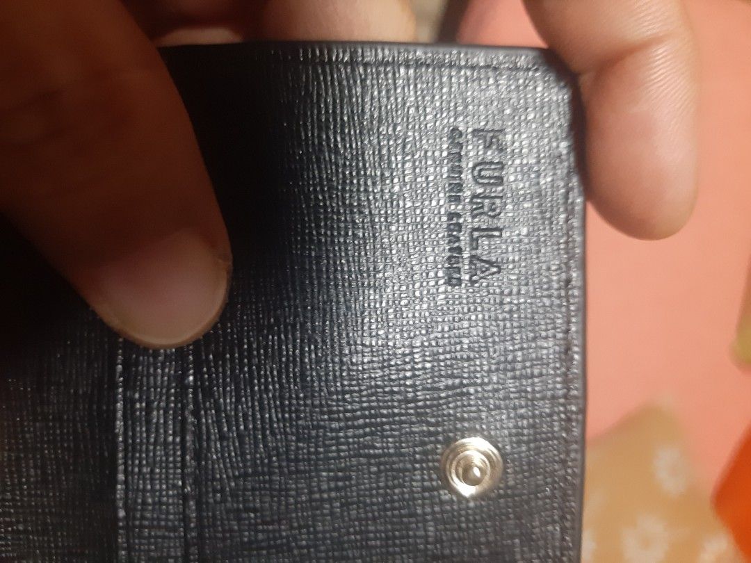 Furla Black Leather Card Holder (Category: Luxury Bags & Wallets) located in Bulacan. Submitted by edisoncert71953 (Listing ID 1462056567, Image 2). Description: - Authentic Furla card holder - Black textured leather - Secure snap button closure - Multiple interior card slots - Comes with 'Import Good Quality Guarantee' card - Ideal for keeping your essentials organized.