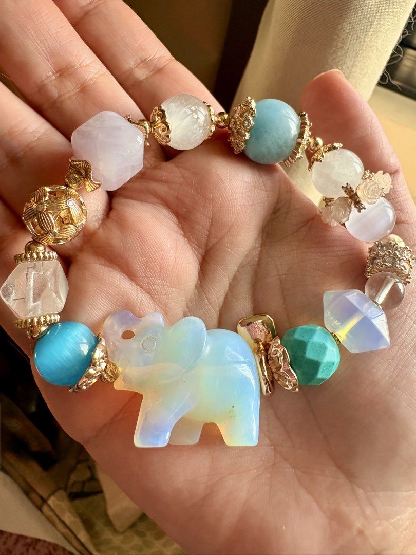 Gemstone DIY bracelet (Category: Bracelets) located in Manila. Submitted by charliesxcharms (Listing ID 1462039301, Image 3). Description: Opalite elephant charm, clear quartz, opalite, turquiose, selenite, moonstone, lavander moon, white jade.
