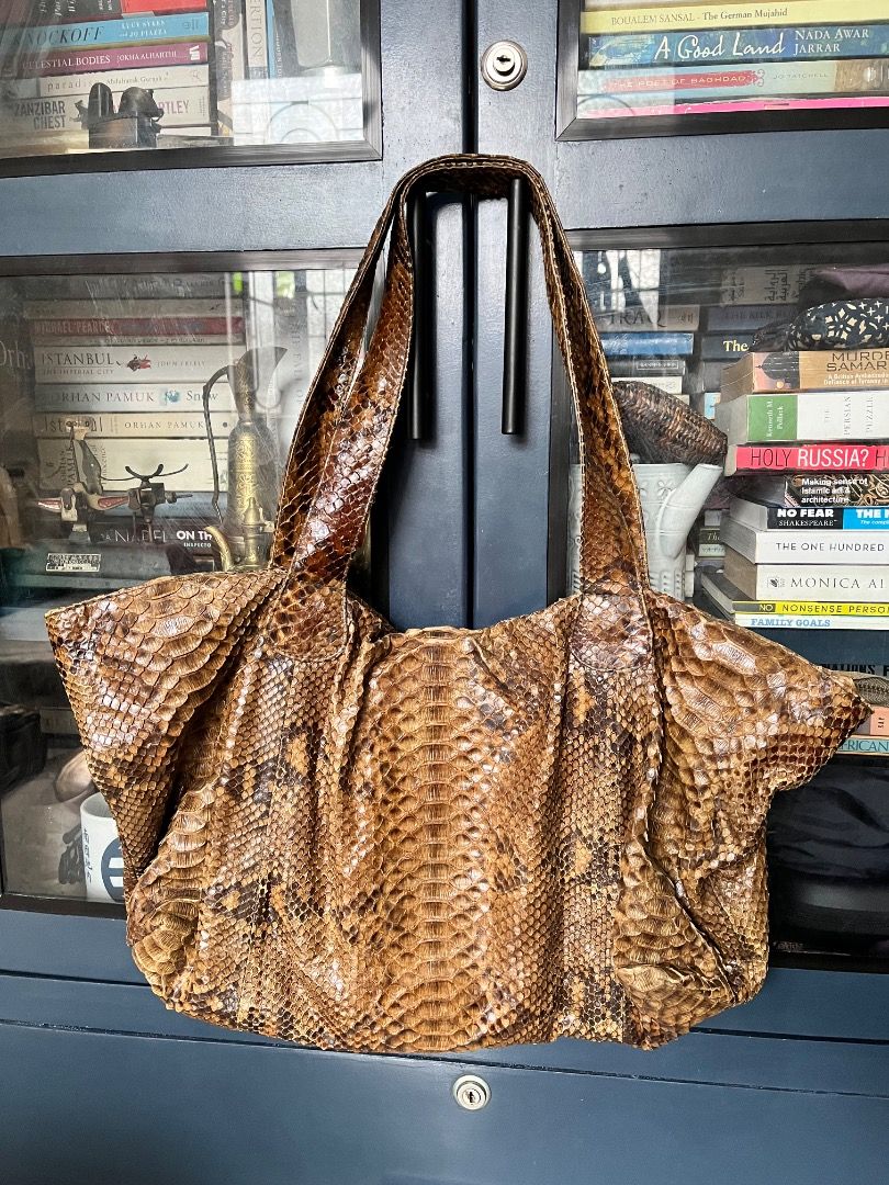 Genuine Python Snakeskin Tote Bag (Category: Tote Bags) located in Makati City. Submitted by Ina_Ndang (Listing ID 1462164701, Image 1). Description: - Genuine python snakeskin tote bag - Rich brown and tan scale pattern - Spacious interior, perfect for everyday use - Comfortable shoulder straps - Unique statement piece ~~~~~~~~~ Approximate dimension: 17.5 inches width, 13 inches height, 19 inches bag handles/drop - No flaws, preloved - Payment 