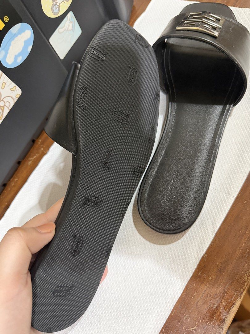 Givenchy Black Leather G Chain Slides Sandals (Category: Sneakers & Footwear) located in Manila. Submitted by pearlprincess3000 (Listing ID 1462072314, Image 2). Description: - Authentic Givenchy black leather slides - Features iconic G chain detail on strap - Comfortable flat sole for everyday wear - Made in Italy - Size: 40 - Please check photos for condition details -negotiable -resoled to non slip soles -NO DAMAGE -with original dustbag -no b