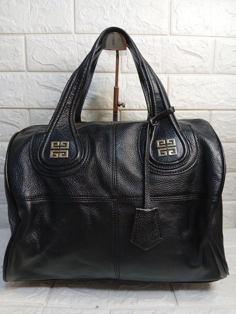 Givenchy Black Leather Nightingale Boston Bag (Category: Tote Bags) located in Las Pinas. Submitted by etoksi1234 (Listing ID 1462125584, Image 1). Description: Pre-loved Givenchy Nightingale bag black textured leather featuring distinctive silver-tone 4G logo hardware accents on the handle attachments. No sling included..