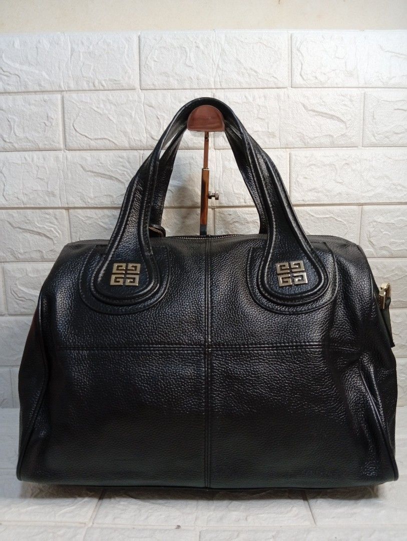Givenchy Black Leather Nightingale Boston Bag (Category: Tote Bags) located in Las Pinas. Submitted by etoksi1234 (Listing ID 1462125584, Image 2). Description: Pre-loved Givenchy Nightingale bag black textured leather featuring distinctive silver-tone 4G logo hardware accents on the handle attachments. No sling included..