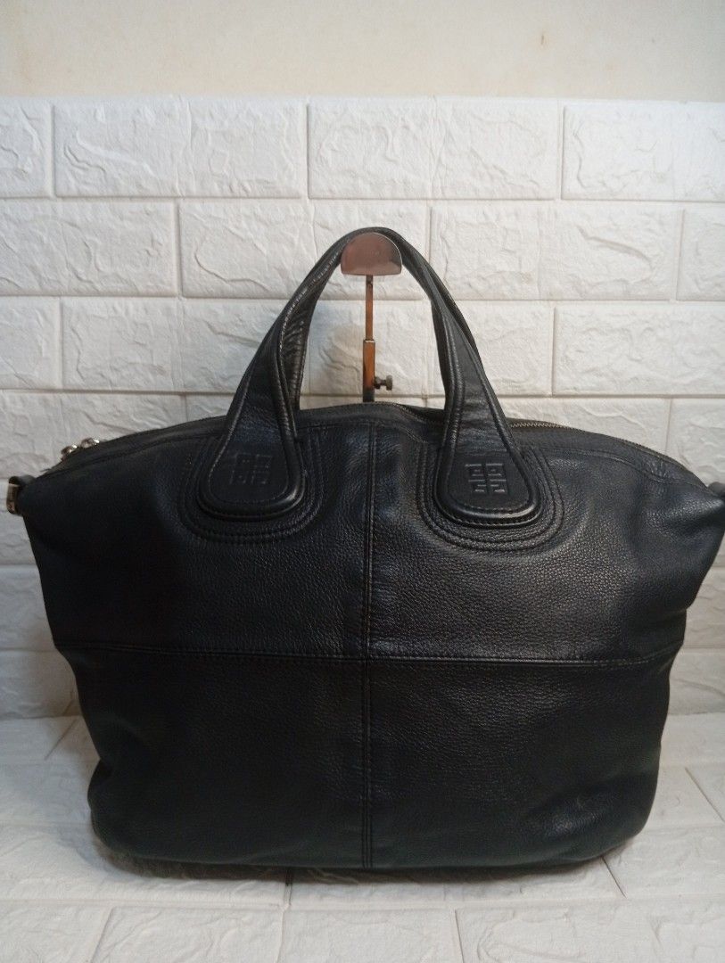 Givenchy Black Leather Nightingale Bag (Category: Tote Bags) located in Las Pinas. Submitted by etoksi1234 (Listing ID 1462199006, Image 2). Description: Pre-loved Givenchy Nightingale bag. Classic black leather Spacious and textured leather. Zipper closure, sturdy handles. Perfect everyday bag, shows some handle wear. No sling included..