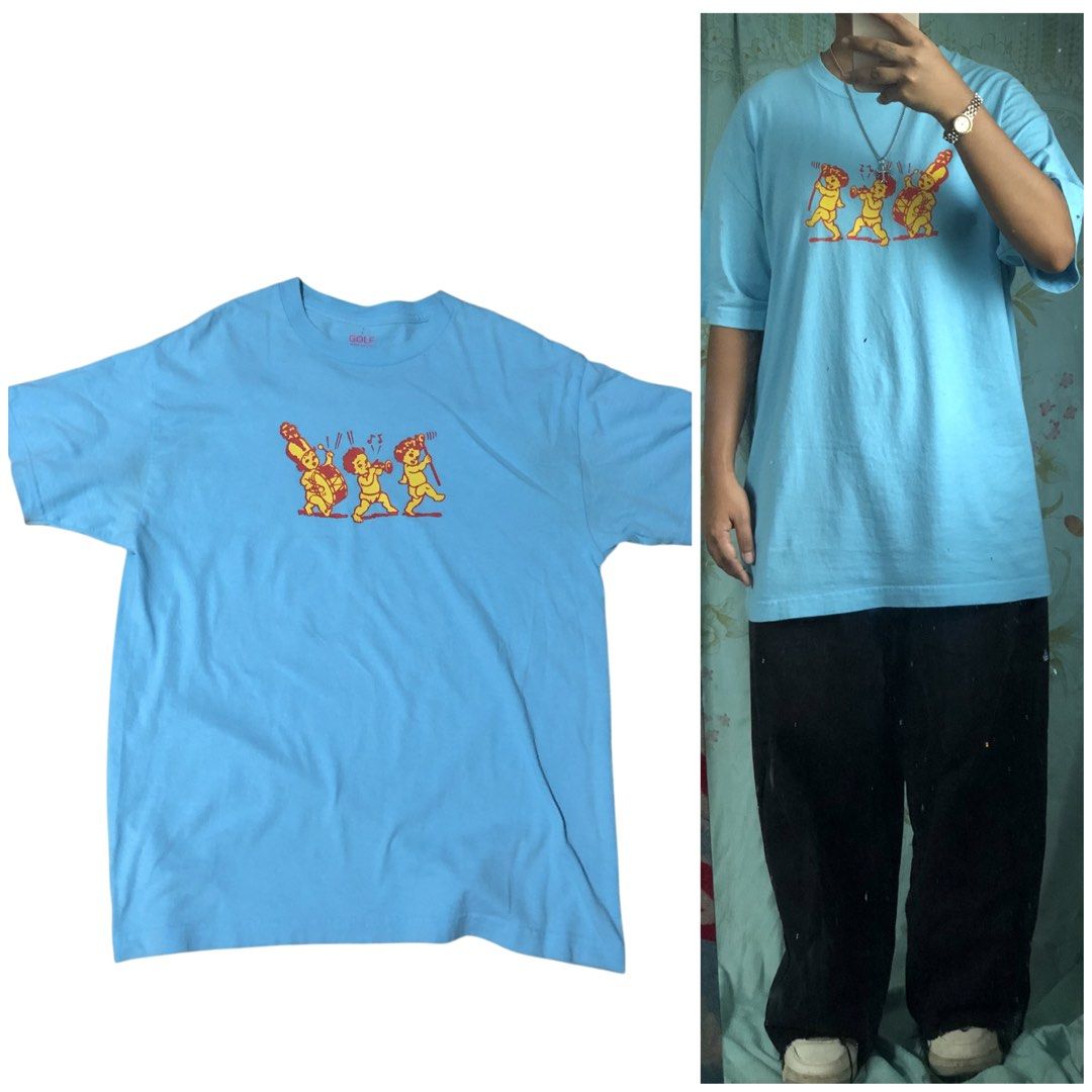 Golf Wang Marching Babies (tyler the creator) (Category: Tshirts & Polo Shirts ) located in Manila. Submitted by thriftlangs_ig (Listing ID 1462234212, Image 1). Description: Issue: May dalawang maliit na butas sa neck part malapit sa dag and may maliit na bleach stain sa sleeve 📏Measurement: L: 28 1.2 W: 21 S: Large 5’0 Model Condition: 8/10 Dm if interested.