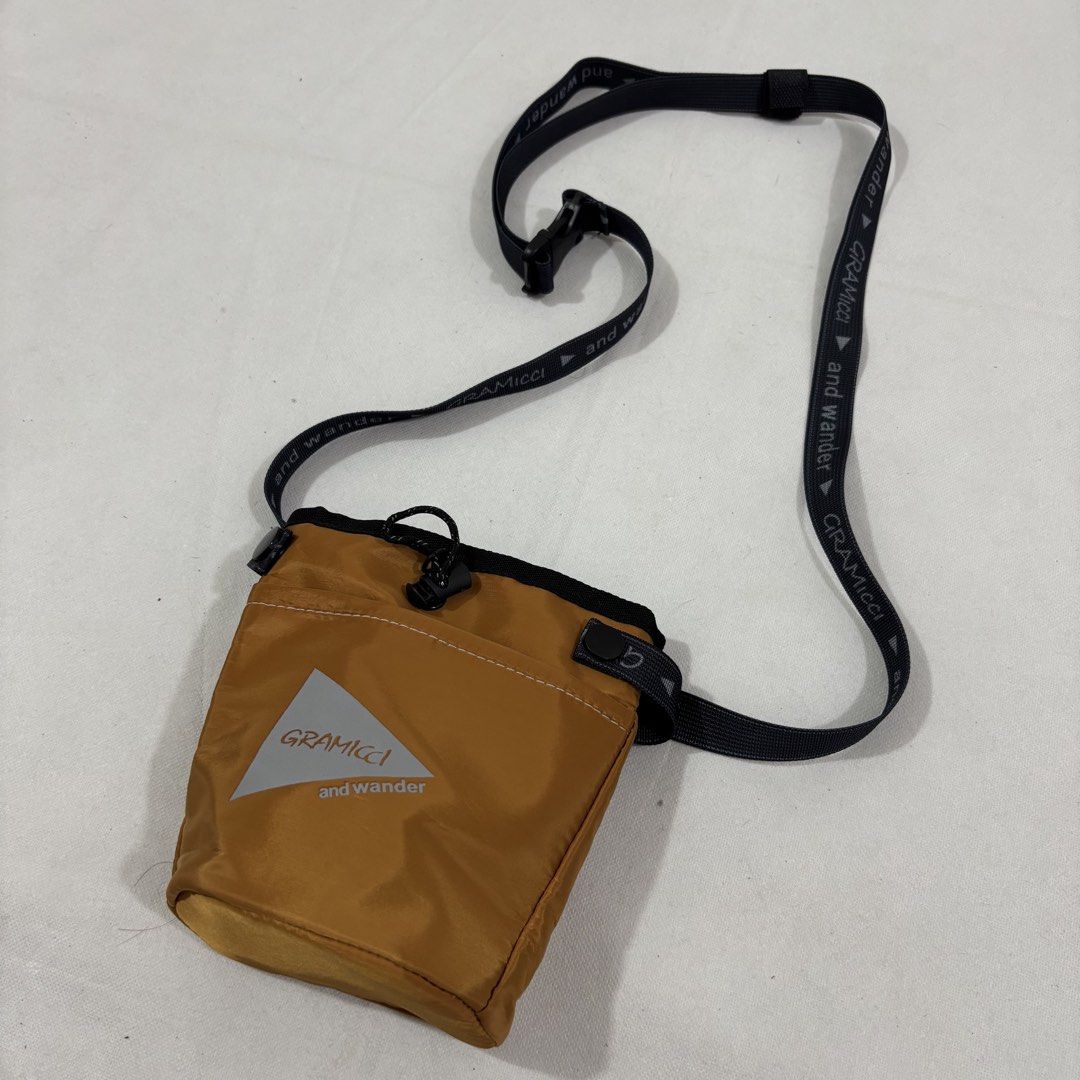 Gramicci and Wander Shoulder Pouch Bag (Category: Sling Bags) located in Cavite. Submitted by itsayaaa (Listing ID 1462095014, Image 2). Description: - Yellow Gramicci x Wander pouch bag - Adjustable strap with branding - Secure drawstring closure - Convenient small front pocket - Ideal for carrying essentials on the go - Perfect for outdoor adventures or everyday casual wear.