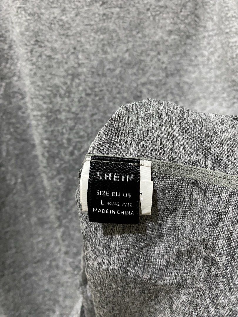 Gray drifit tee (Category: Shirts) located in Makati City. Submitted by indaysukaycloset (Listing ID 1462090181, Image 2). Description: GRAY DRIFIT TEE! 🩶 Mine: drifitgray ₱100 Brand: SHEIN | Size L on tag Width: 19" flat (38" paikot) Length: 23" - Color: Gray heather - Fabric: Drifit / poly blend - presko & stretchy! - Back print: "SPECIAL YOU ARE ONE IN A MILLION" - Pang-gym / pang-jogging / pang-daily - Lightweight & breathable - 9/10 conditi