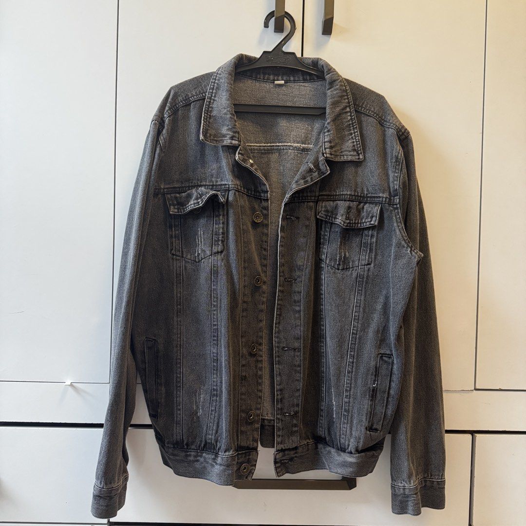 Grey Washed Denim Jacket (Category: Coats, Jackets and Outerwear) located in Quezon City. Submitted by closet.aid (Listing ID 1462113930, Image 1). Description: - Classic grey washed denim jacket - Button-up front - Two chest pockets - Slightly distressed look - Ideal for layering - Versatile wardrobe staple.
