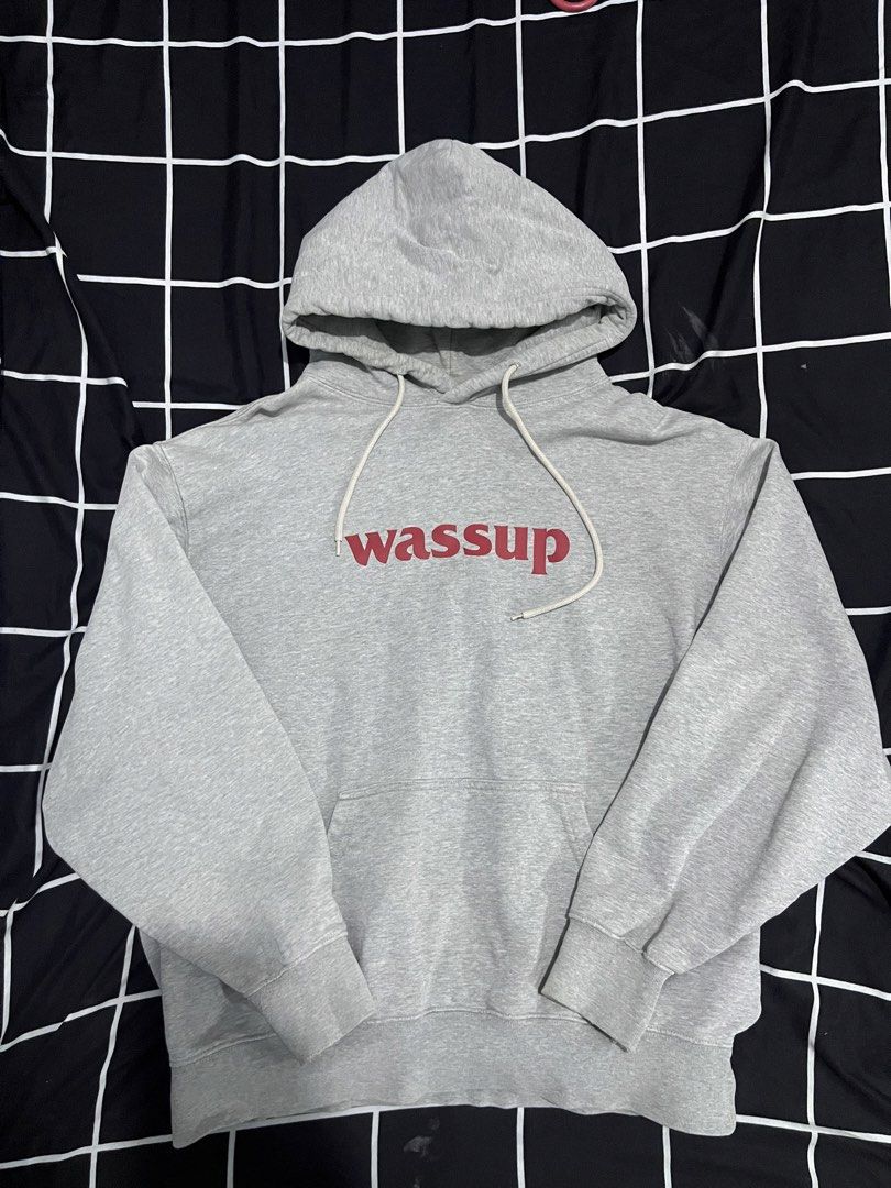 Grey 'wassup' Hoodie (Category: Hoodies) located in Manila. Submitted by aybancharlesss (Listing ID 1462182596, Image 1). Description: - Grey hoodie with 'wassup' graphic print on the front - Features a convenient front pocket - Adjustable drawstring hood for a personalized fit - Casual and comfortable, ideal for everyday wear.
