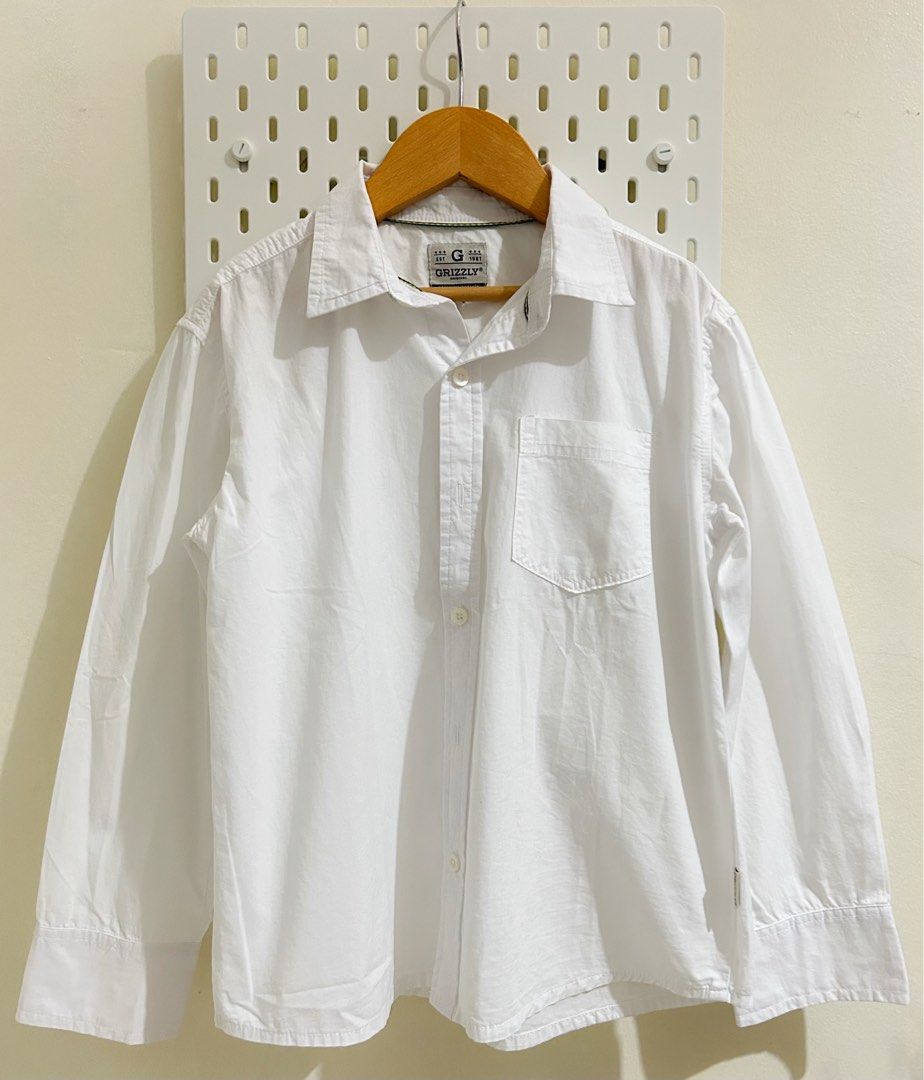 Grizzly White Long- Sleeve Button-Down (Category: Babies & Kids Fashion) located in Manila. Submitted by maison_marie (Listing ID 1462190324, Image 1). Description: Brand: Grizzly Original Unisex Size: 6 on tag Purchased from SM Department Store in February 2025 and used only once for a rondalla concert.My daughter was already 10 years old when she wore it. She is petite, so it fit her well. Location: Malate, Manila Available for pick-up or same-