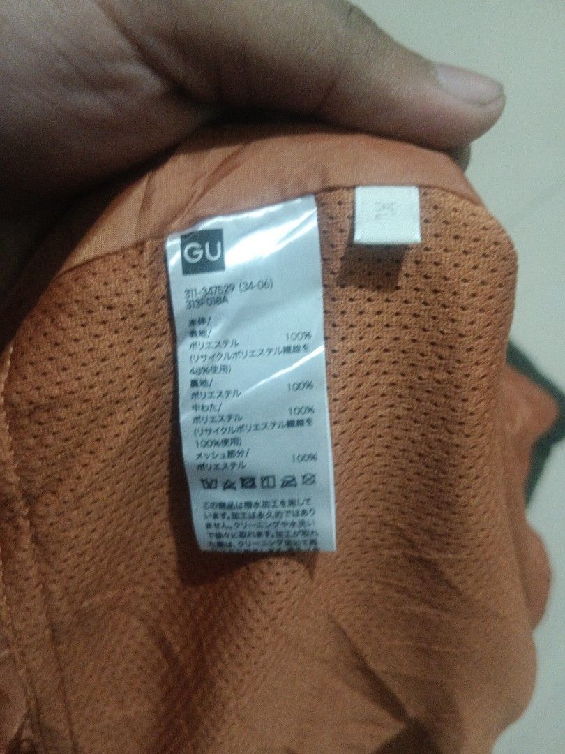 GU Puffer Vest Green Orange Reversible (Category: Coats, Jackets and Outerwear) located in Manila. Submitted by xelll7 (Listing ID 1462078887, Image 2). Description: - GU Green Puffer Vest - Reversible with orange lining - Features front pockets - Ideal for layering and cooler weather - Material details on tag - Selling as is.
