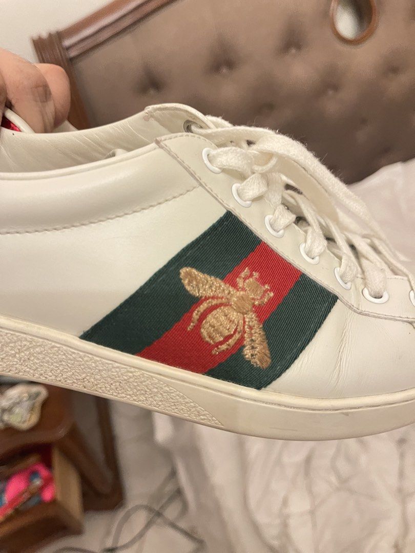 Gucci Ace Embroidered Sneaker White Bee (Category: Sneakers) located in Marilao. Submitted by wardrovearchives (Listing ID 1462190967, Image 3). Description: - Authentic White Leather Gucci Sneakers - Iconic Green and Red Stripe Detail - Embroidered Bee Motif - Red Accent on Heel - Classic Lace-Up Style - Ideal for Casual Wear -w/ Dustbag.