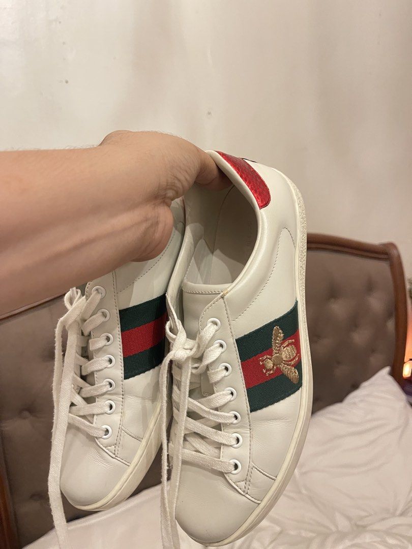 Gucci Ace Embroidered Sneaker White Bee (Category: Sneakers) located in Marilao. Submitted by wardrovearchives (Listing ID 1462190967, Image 1). Description: - Authentic White Leather Gucci Sneakers - Iconic Green and Red Stripe Detail - Embroidered Bee Motif - Red Accent on Heel - Classic Lace-Up Style - Ideal for Casual Wear -w/ Dustbag.