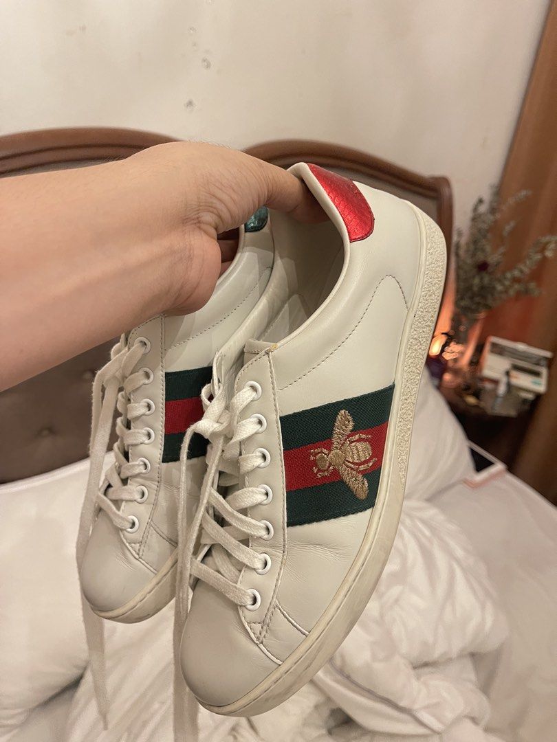 Gucci Ace Embroidered Sneaker White Bee (Category: Sneakers) located in Marilao. Submitted by wardrovearchives (Listing ID 1462190967, Image 2). Description: - Authentic White Leather Gucci Sneakers - Iconic Green and Red Stripe Detail - Embroidered Bee Motif - Red Accent on Heel - Classic Lace-Up Style - Ideal for Casual Wear -w/ Dustbag.