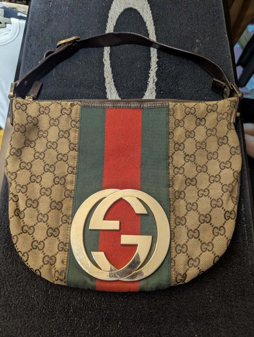 Gucci Monogram Canvas & Leather Stripe Hobo Bag (Category: Luxury Bags & Wallets) located in Manila. Submitted by roblesniks33584 (Listing ID 1462047067, Image 1). Description: - Authentic Gucci hobo bag - Classic GG monogram canvas - Signature green and red stripe detail - Genuine leather trim and strap - Interior zippered pocket - Leather tag with serial number - Gucci branded zipper pull - Perfect for everyday use.