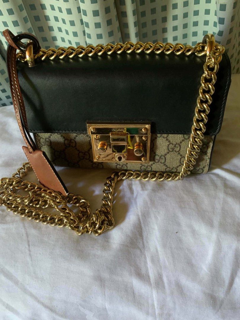 Gucci Padlock GG Supreme Canvas Shoulder Bag (Category: Luxury Bags & Wallets) located in Manila. Submitted by notjaneahe05680 (Listing ID 1462072332, Image 1). Description: - Authentic Gucci shoulder bag - GG Supreme canvas with black leather trim - Gold-tone hardware and chain strap - Secure lock closure at the front - Interior serial number tag for authenticity - Versatile for day or night use Rush sale! Pm me no issues and original Price nego