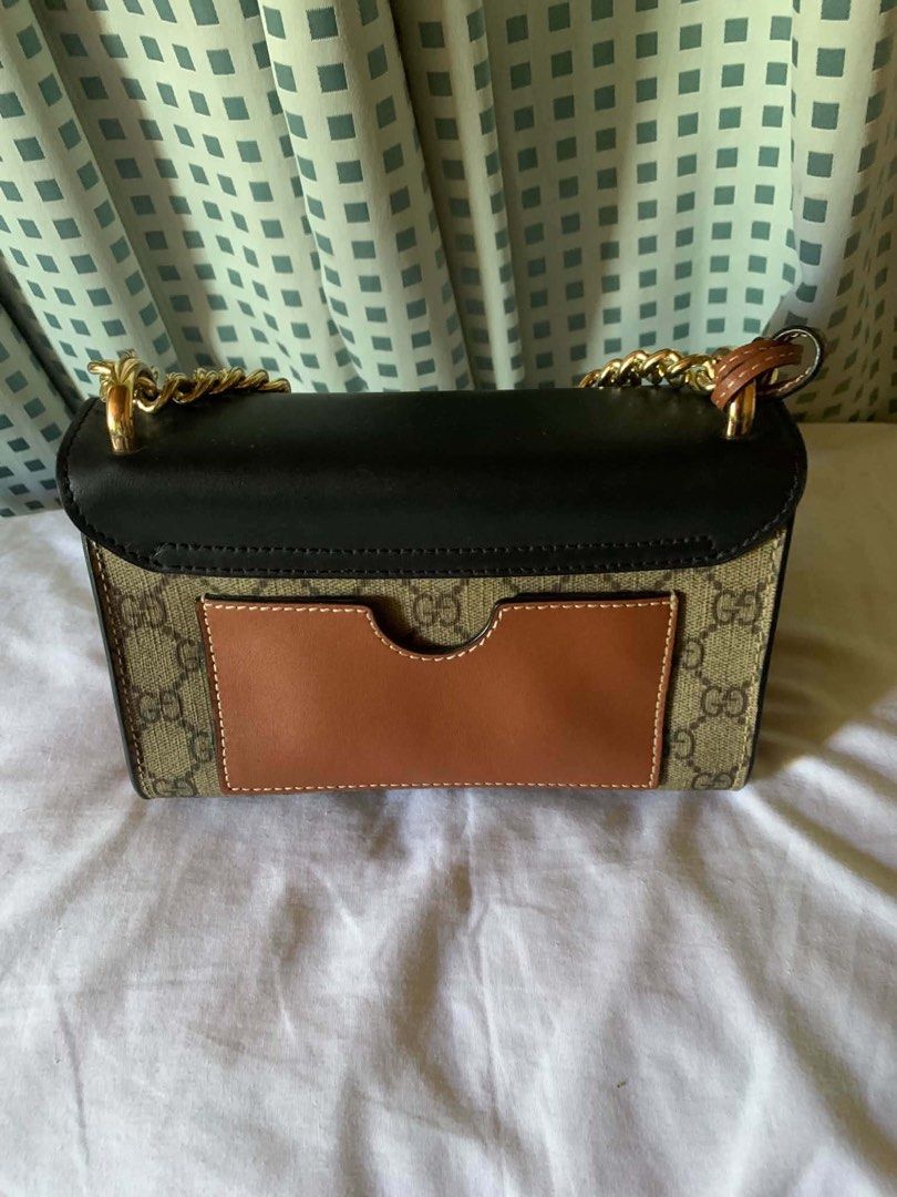 Gucci Padlock GG Supreme Canvas Shoulder Bag (Category: Luxury Bags & Wallets) located in Manila. Submitted by notjaneahe05680 (Listing ID 1462072332, Image 2). Description: - Authentic Gucci shoulder bag - GG Supreme canvas with black leather trim - Gold-tone hardware and chain strap - Secure lock closure at the front - Interior serial number tag for authenticity - Versatile for day or night use Rush sale! Pm me no issues and original Price nego