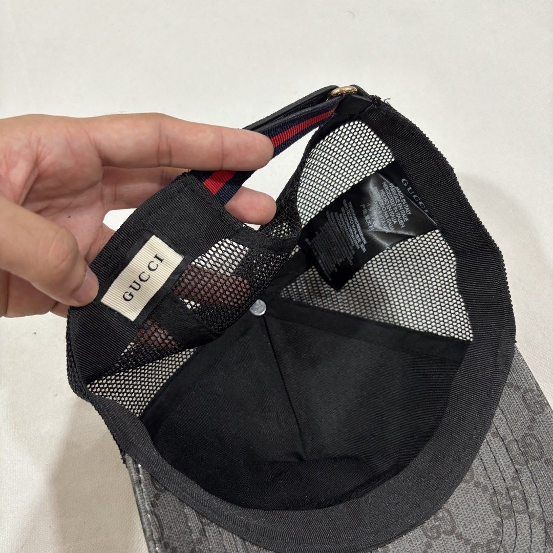 Gucci Tiger Print Mesh Trucker Cap (Category: Caps & Hats) located in Cavite. Submitted by itsayaaa (Listing ID 1462095282, Image 2). Description: - Grey Gucci Cap - All-over GG Pattern - Two Embroidered Tiger Heads on Front - Black Mesh Back for Breathability - Adjustable Strap with Signature Gucci Ribbon Detail - Ideal for Casual Wear.