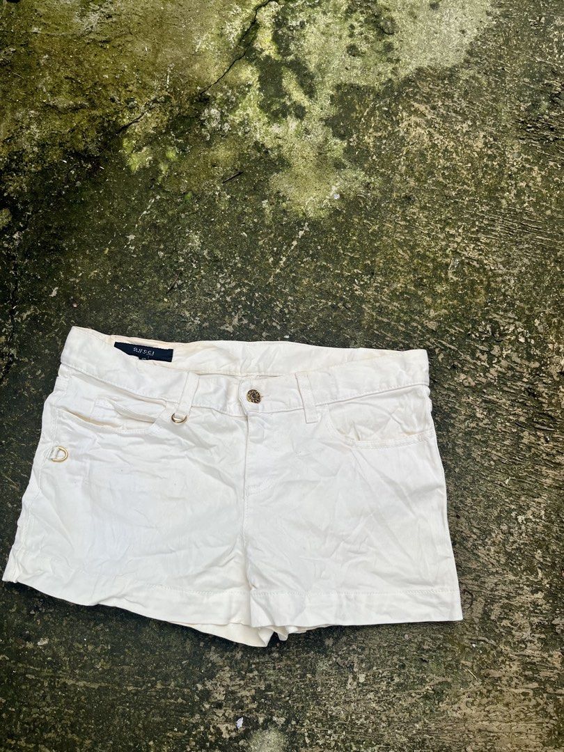 Gucci White Denim Shorts Size 40 (Category: Shorts) located in Manila. Submitted by shanaaa.collects (Listing ID 1462124195, Image 1). Description: - Authentic Gucci white denim shorts - Made in Italy - Features elegant gold hardware details - Classic five-pocket styling - Convenient zip fly - Ideal for versatile casual wear.