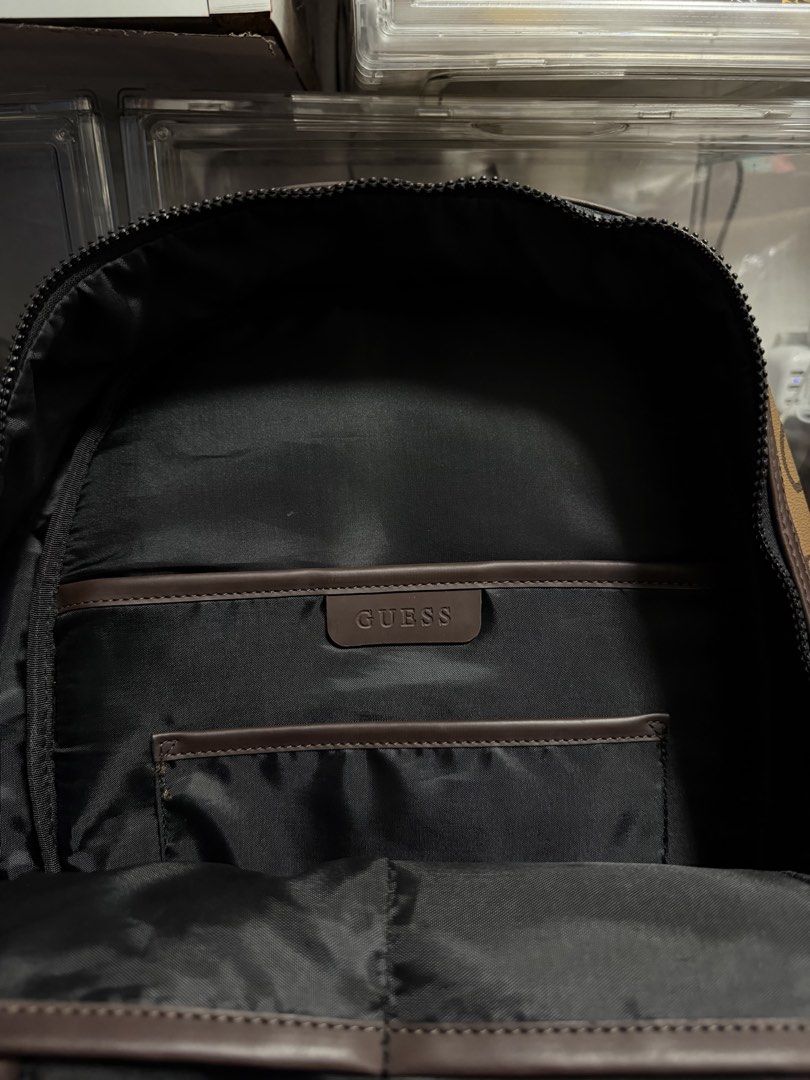 Guess Insignia Monogram Backpack Brown (Category: Backpacks) located in Cainta. Submitted by tinpalma (Listing ID 1462090631, Image 2). Description: - Stylish brown Guess backpack with all-over monogram print. - Features a convenient front zip pocket. - Main compartment includes internal pockets for organization. - Padded back and adjustable straps ensure maximum comfort. - Ideal for everyday use, school, or travel adventures..