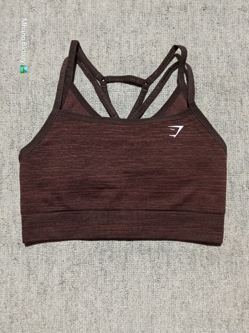 Gymshark Adapt Marl Seamless Bra - Size Small (Category: Activewear) located in Valencia. Submitted by mhano_bidaay_outdoors_218 (Listing ID 1462192685, Image 2). Description: - Gymshark Adapt Marl Seamless Bra - Size: Small - Color: Marl Brown - Features: Comes with pads, strappy back design - Condition: Excellent - Perfect for workouts or everyday wear.