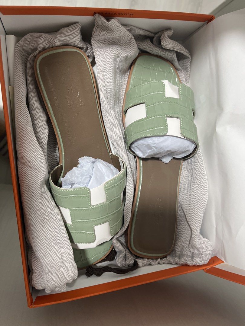 H Sandals Size 39 Mint Green (Category: Flats & Sandals) located in Pasig City. Submitted by melaiski28 (Listing ID 1462113357, Image 2). Description: - Hermes Izmir Sandals - Color: Mint Green - Size: 39 - Made in Italy - Material: Leather sole - Includes: Original box and dust bag - Style: Super comfy slides, perfect for casual wear.