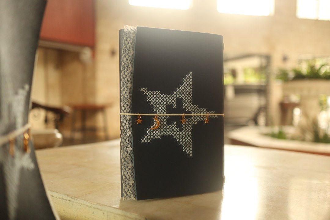 Hand Embroidered Journal - Midnight Wish (Category: Stationery & School Supplies) located in Mandaue City. Submitted by fromynalou (Listing ID 1462178316, Image 1). Description: Dark blue leather embellished with a delicate embroidered star, finished with lace details and moon and star charms. size: A5 on instagram:@thegentlefoldx@fromynalou .