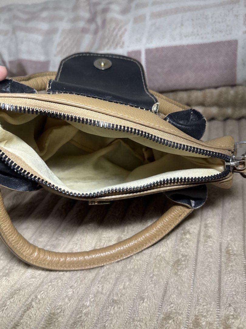 Handbag (Category: Tote Bags) located in Pasay City. Submitted by christinetek (Listing ID 1462117715, Image 3). Description: - Cute tan handbag - Textured faux leather material - Button snap closure on flap (No strap included).