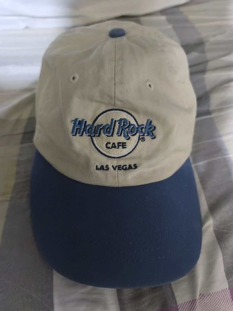 Hard Rock Cafe Las Vegas Cap (Category: Caps & Hats) located in Manila. Submitted by rms.thrift (Listing ID 1462170343, Image 1). Description: - Classic Hard Rock Cafe cap - Beige crown with navy blue brim - Embroidered logo on front - Adjustable strap for a good fit -Very good condition - No issue.