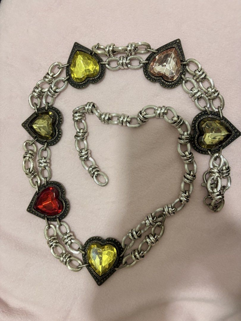 Heart Gem Chain Belt Silver Tone (Category: Belts) located in Iligan City. Submitted by nebulanookph (Listing ID 1462161104, Image 2). Description: - Silver tone chain belt - Double chain design - Heart-shaped gems in red, yellow, and pinkish hues - Clasp closure - Adds color and sparkle to outfits - Versatile for jeans or dresses.