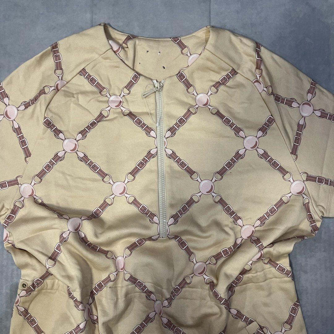 HERMES Beige Dress with Horse Bit Pattern (Category: Dresses) located in Dumaguete. Submitted by deniokthrift (Listing ID 1462162125, Image 2). Description: - Beige short sleeve dress - Repeating horse bit and strap pattern - Quarter zip neckline - Convenient side pockets Grand tralala robe dress W21 L33.4 Excellent condition No lace/cut tags Last pic for reference only .