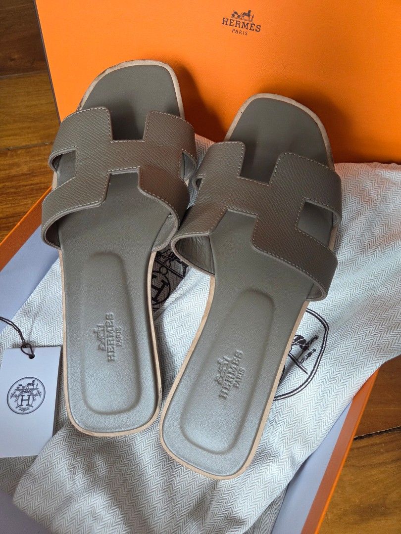 Hermes Oran Etoupe size 37 (Category: Sandals) located in Quezon City. Submitted by shop.mar.go (Listing ID 1462074466, Image 2). Description: comes with tag, dust bag and box size 37 used twice fits ladies size 7 to 7.5.