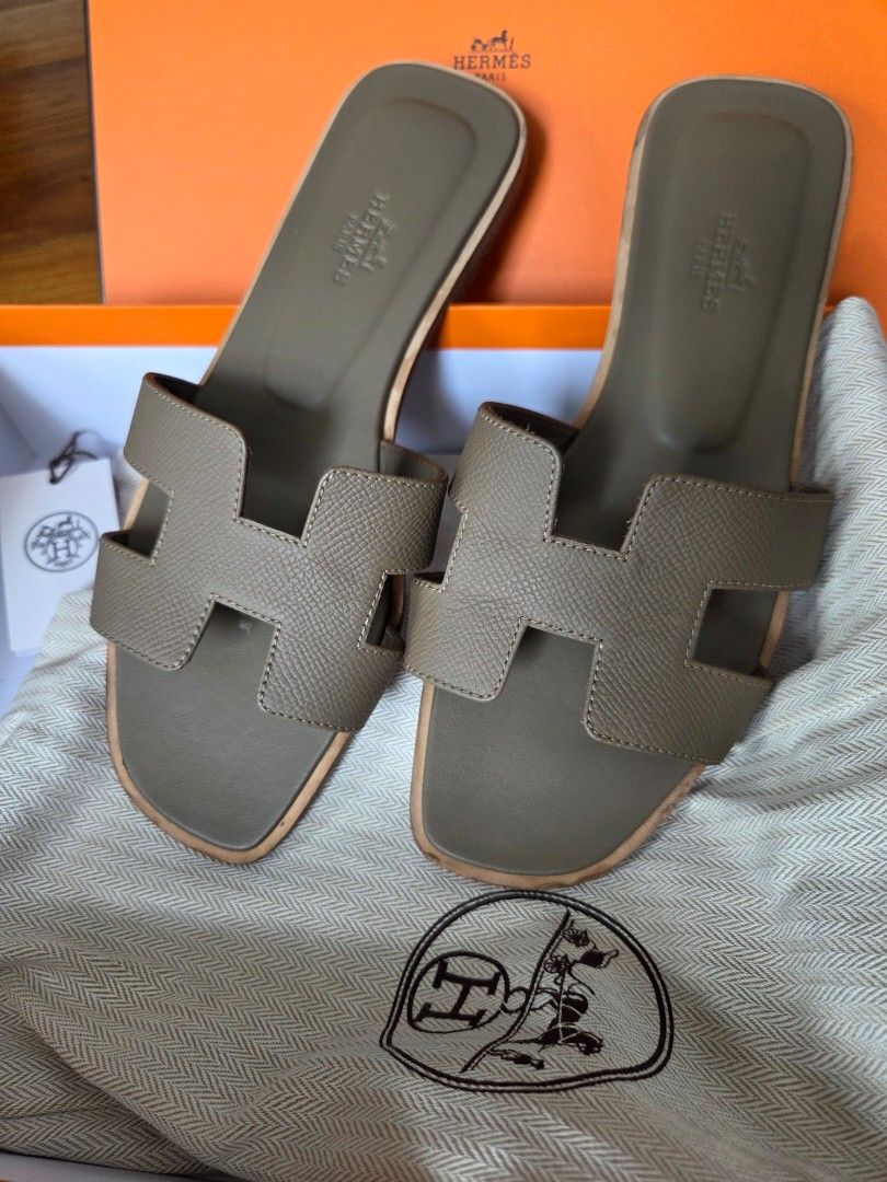 Hermes Oran Etoupe size 37 (Category: Sandals) located in Quezon City. Submitted by shop.mar.go (Listing ID 1462074466, Image 1). Description: comes with tag, dust bag and box size 37 used twice fits ladies size 7 to 7.5.