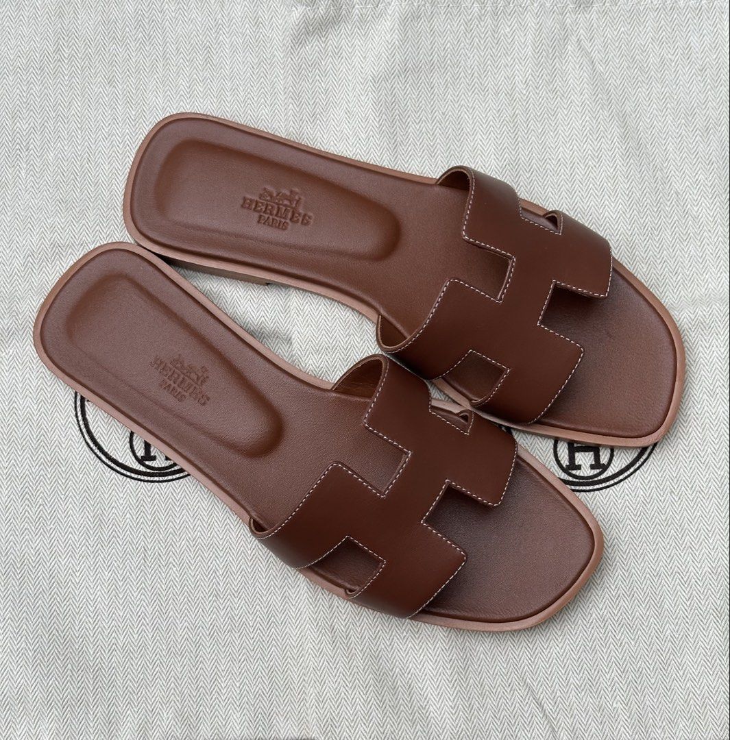 Hermes sandals (Category: Flats & Sandals) located in Legazpi City. Submitted by gettinmycloset01 (Listing ID 1462120906, Image 3). Description: - Authentic Classic Hermes H sandals - Color: Brown - Material: Smooth leather - Style: Slides - Features: Timeless design, easy slip-on/off - Versatile: Great for casual outings or dressing up an outfit - Wardrobe essential.
