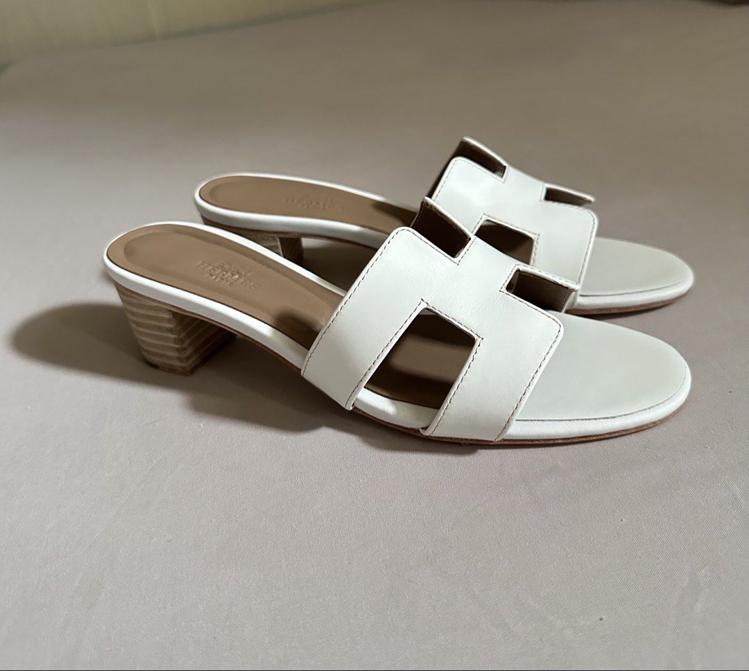 Hermes sandals (Category: Flats & Sandals) located in Legazpi City. Submitted by gettinmycloset01 (Listing ID 1462121752, Image 3). Description: - Authentic white leather Hermes oasis sandals - Features the iconic 'H' design - Comfortable block heel for all-day wear - Classic and chic style - Perfect for dressing up or down - A versatile addition to your wardrobe.