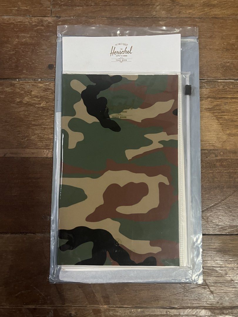 HERSCHEL Camo Plastic Sleeve for Documents Organizer (Category: Stationery & School Supplies) located in Manila. Submitted by carmiscloset (Listing ID 1462121631, Image 1). Description: - Brand: Herschel - Item: Plastic Sleeve for Documents Organizer - Design: Camouflage print - Material: Durable plastic - Function: Organizes documents, papers, and small notebooks - Style: Trendy and practical.
