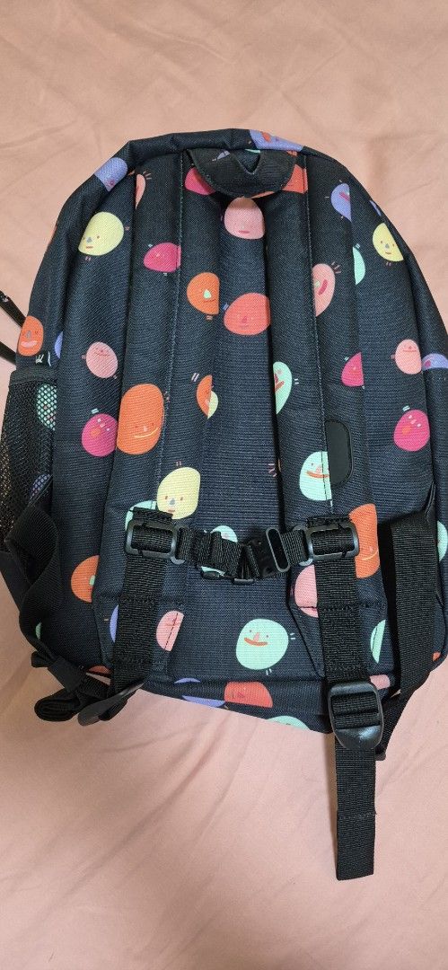 Herschel Supply Co. Backpack - Funky Polka Dot Print (Category: Backpacks) located in Pasig City. Submitted by decluttermyclosetph (Listing ID 1462130973, Image 3). Description: - Fun polka dot print (black base with pink, orange, purple, green dots) - Front zip pocket for easy access - Spacious main compartment with internal pockets - Adjustable straps for comfortable carrying - Ideal for school, travel, or everyday adventures.