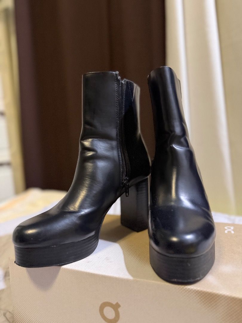 H&M Black Ankle Boots (Category: Boots) located in Caloocan City. Submitted by mariel_angela (Listing ID 1462068144, Image 2). Description: - Black ankle boots - Platform and chunky heel - Side zipper closure - Cool, edgy vibe - Perfect for dressing up or down - Pairs well with jeans or dresses.