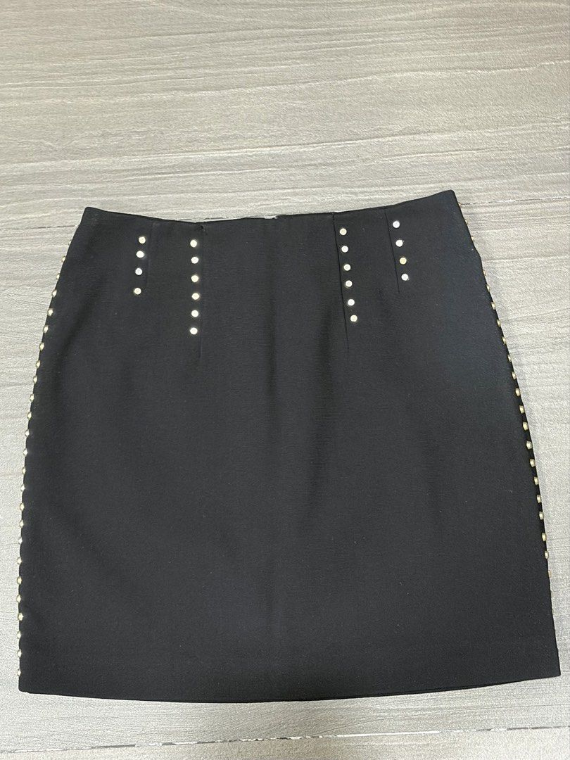 H&M Black Studded Mini Skirt (Category: Skirts) located in Quezon City. Submitted by kendejesus101 (Listing ID 1462065741, Image 1). Description: - Black mini skirt from H&M - Features stud details on hem and waistband - Zipper closure at the back - Lined interior - Perfect for dressing up or down, pair with heels or sneakers.