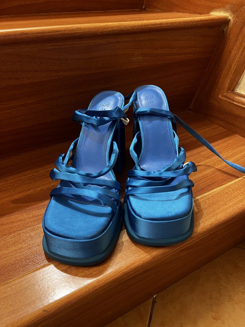 H&M Blue Satin Platform Strappy Heels (Category: Heels) located in Taguig. Submitted by banannananas (Listing ID 1462207151, Image 1). Description: - Brand: H&M - Color: Blue - Material: Satin - Style: Platform heels - Features: Strappy design, tie-up ankle strap, chunky block heel - Condition: Brand new, never worn - Perfect for: Dressing up outfits.