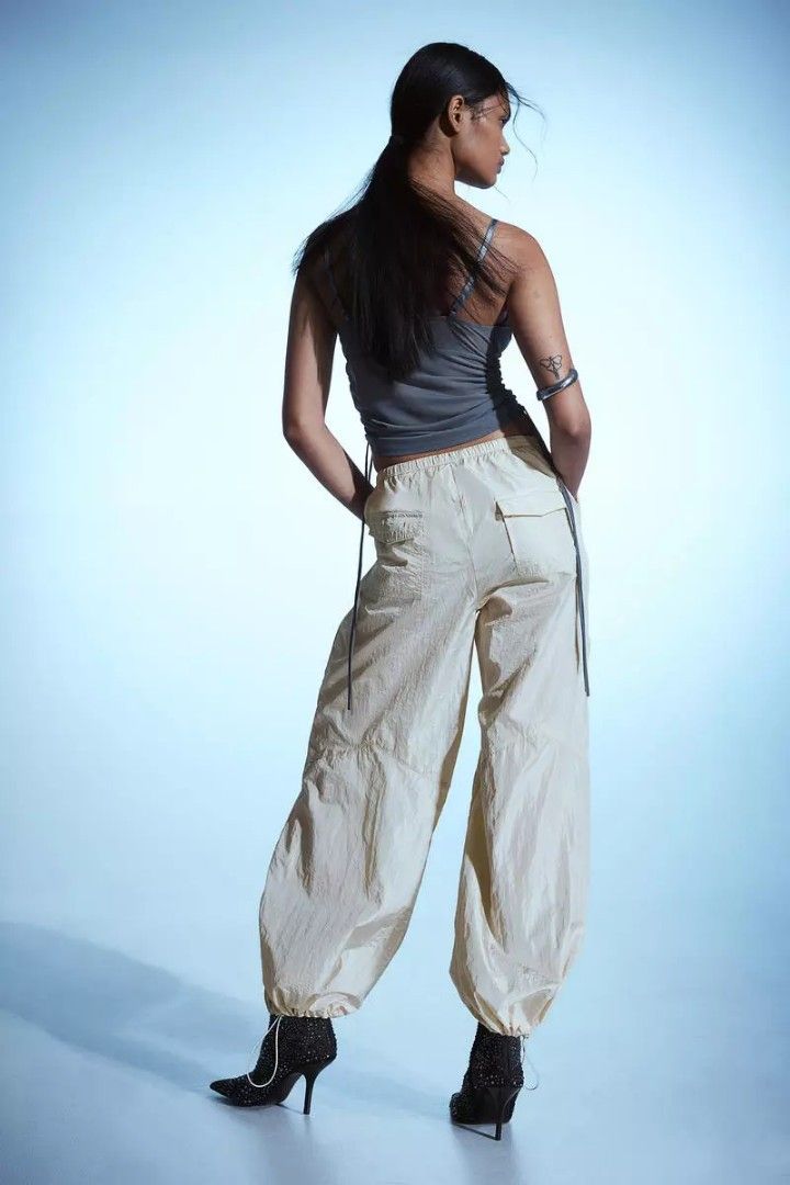 H&M Cream Parachute Pants (Category: Other Bottoms) located in Quezon City. Submitted by declutteringnook (Listing ID 1462079682, Image 1). Description: - size: xs - loose / oversized fit - fabric is lightweight, crinkled nylon material - elasticized cuff around the ankles - dance studio fit vibes.