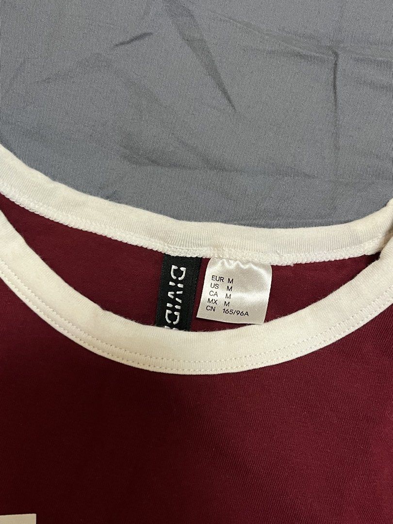 H&M Divided Graphic Tee (Category: Shirts) located in Manila. Submitted by withluvbee (Listing ID 1462209737, Image 3). Description: H&M Divided maroon graphic tee. "Amour 15 Paris" print. White contrast trim. Size M, can fit small. Twice worn only..