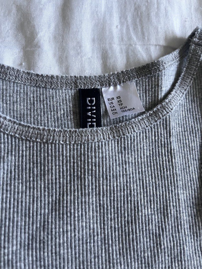 H&M Grey Long Ribbed Tank Top (Category: Sleeveless) located in Taguig. Submitted by gingerderp (Listing ID 1462136045, Image 2). Description: Perfect for the HOT weather! Gives you that effortlessly cool vibe and goes well with anything you pair it with :).