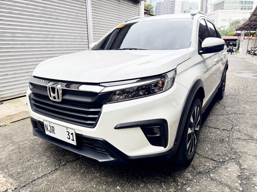 Honda BR-V (Category: Used Cars) located in Pasig City. Submitted by xzytcars (Listing ID 1462242269, Image 1). Description: 🔱 2025 Honda BRV S A/T 🔱 Push Start 7 Seater Climate Control Aircon System Traction Control Daytime Running Lights/ LED Lights Reverse Camera Multiple SRS Airbags Endplate 1 All Original Paint 100% 💯 Cash / Financing / Trade In.